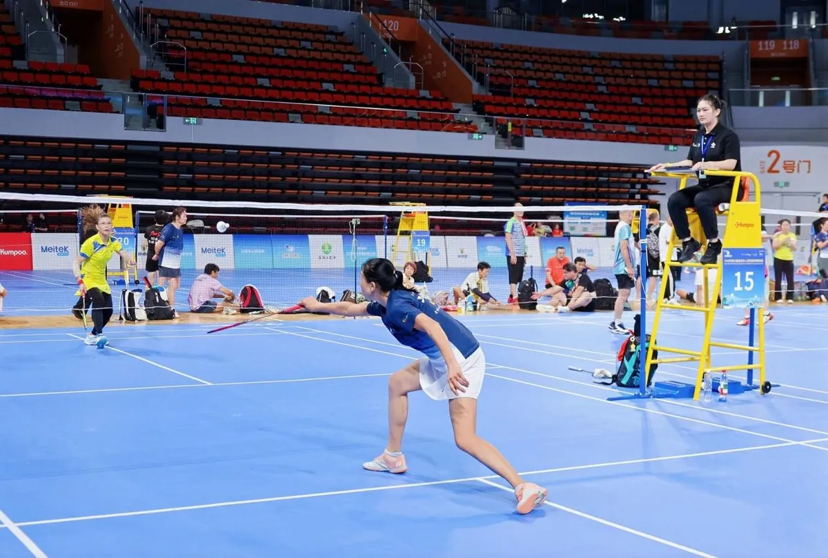 A player returns a shot during a match at Sanya Sports Center